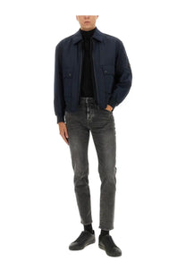 BOSS men’s navy blue bomber jacket with two front flap pockets and a subtle logo patch on the left sleeve