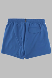 Boss men’s blue swim trunks with elastic waistband and single back pocket shown from the back side