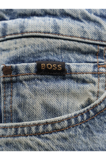A faded blue cotton BOSS men’s denim jeans back pocket with a black embroidered brand label