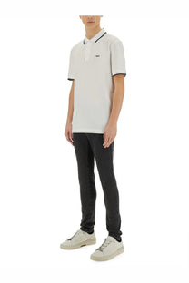 BOSS men’s cotton white polo shirt with black trim on collar and cuffs featuring small embroidered chest logo