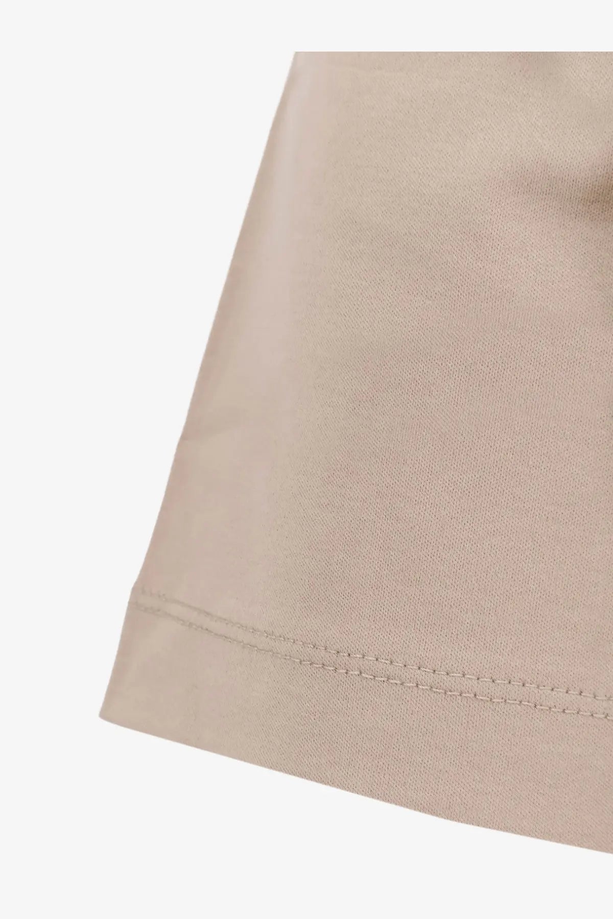 Beige boss men’s cotton shirt showing neat matching stitching along the hem on beige cotton fabric