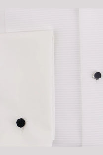 Black knitted cufflink on a white boss men’s cotton dress shirt cuff for formal wear