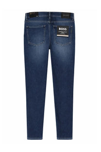 Back view of boss men’s regular fit slim dark blue denim jeans with brand label on waistband and rear pocket