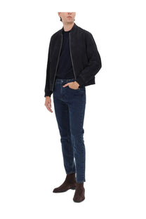 Dark blue slim-fit denim jeans with classic five-pocket design and subtle thigh fading in boss men’s muller jacket blue set