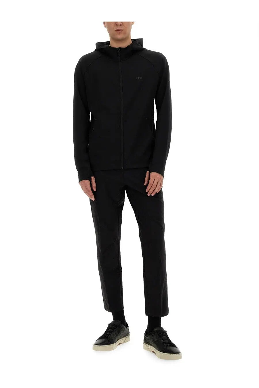 Black zip-up hoodie with subtle logo on chest made from smooth performance fabric in BOSS men’s pants basin black product line