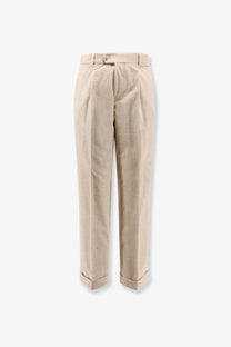 Beige corduroy trousers by boss with classic pleated front and rolled cuffs in men’s peet pleat style