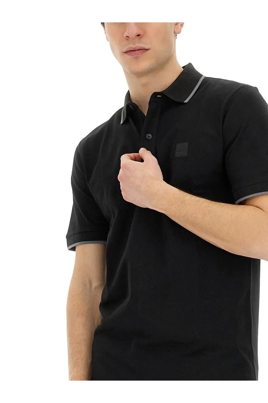 Boss men’s polo black shirt with gray trim on collar and cuffs and a small black logo patch on the chest