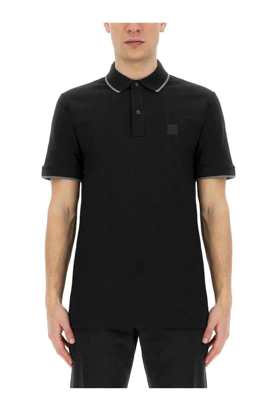 BOSS men’s black short-sleeved polo shirt with gray trim on collar and cuffs featuring a small logo patch