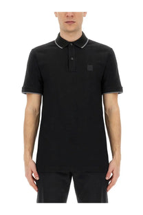 BOSS men’s black short-sleeved polo shirt with gray trim on collar and cuffs featuring a small logo patch
