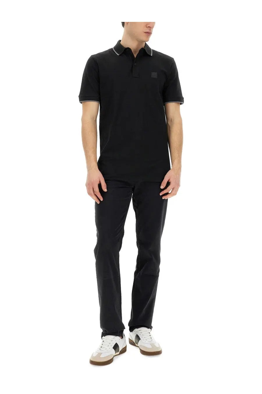 BOSS men’s black short-sleeved polo shirt with subtle contrast collar and sleeve trim featuring a small logo