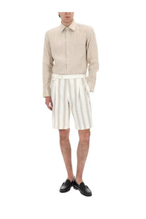 Beige linen button-down shirt with classic collar and long sleeves paired with boss men’s lino white shorts