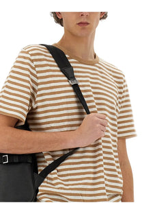 Black leather crossbody bag with sleek minimalist design and silver hardware paired with BOSS men’s beige striped shirt