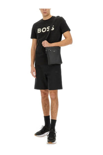 Black hugo boss crossbody bag with sleek minimalist design and subtle branding paired with boss men’s sweatshirt bermuda black