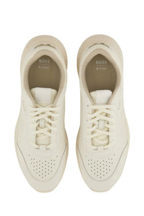 Cream-colored BOSS men’s Titanis sneaker with sleek modern design and perforated detailing in white leather