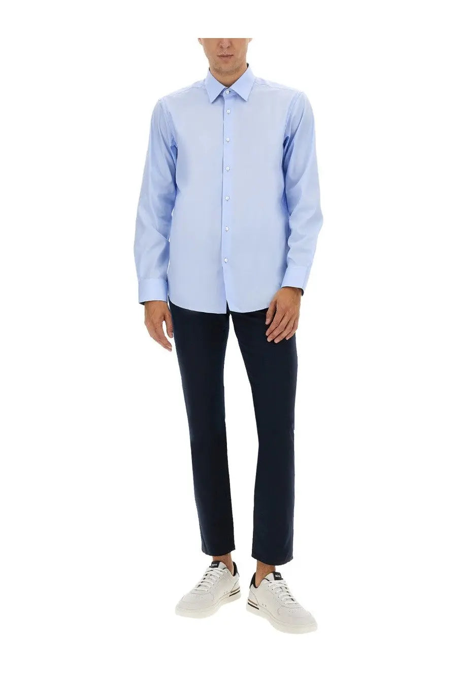Light blue long-sleeved button-down shirt made of soft twill fabric for men paired with boss blue pants