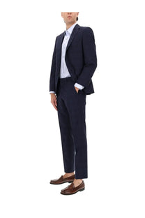 Navy blue tailored two piece dress suit by BOSS with subtle texture and classic fit for men
