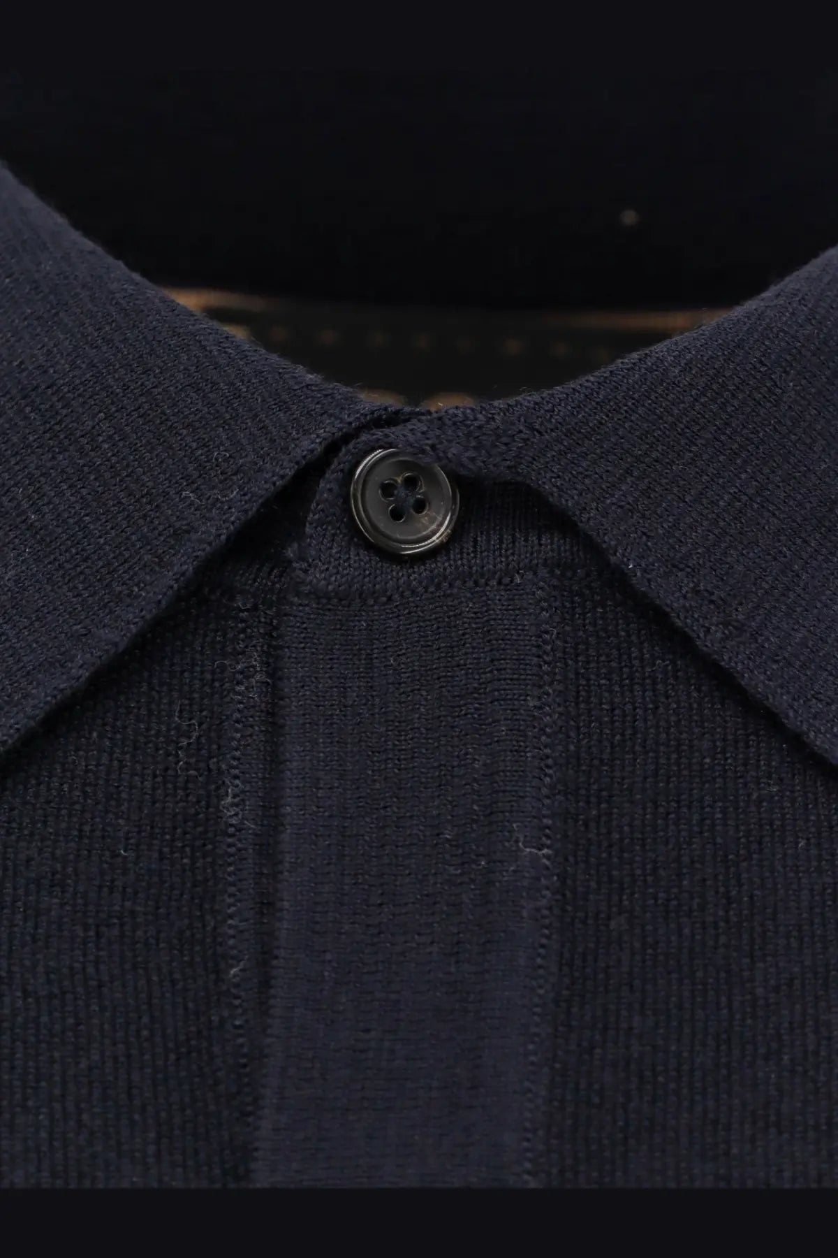 Boss men’s virgin wool polo shirt blue featuring a dark navy knit fabric classic collar and single black button placket