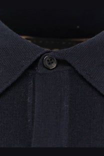Boss men’s virgin wool polo shirt blue featuring a dark navy knit fabric classic collar and single black button placket