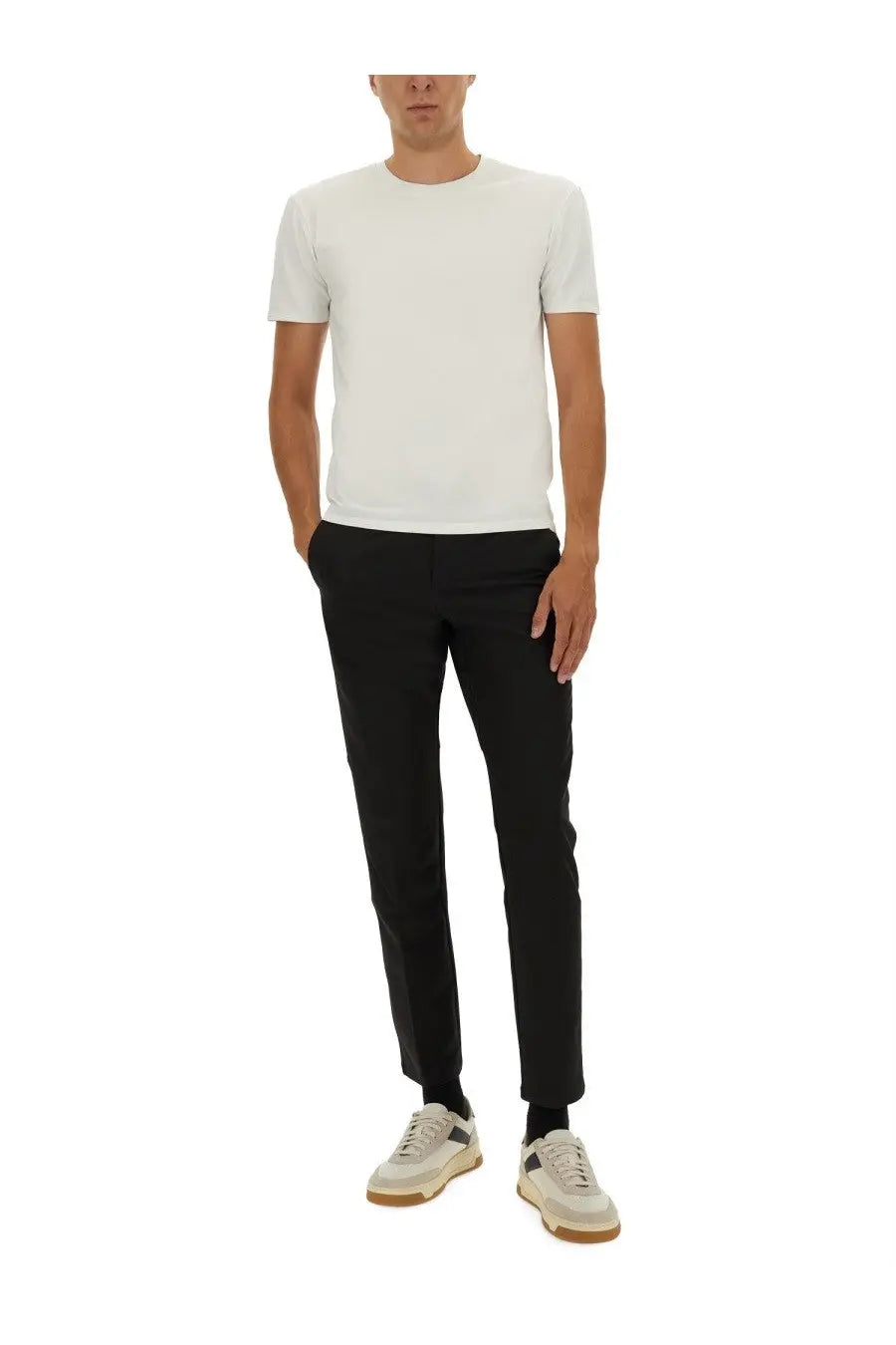 A minimalist white crew neck t-shirt with short sleeves made from smooth lightweight fabric paired with boss black pants