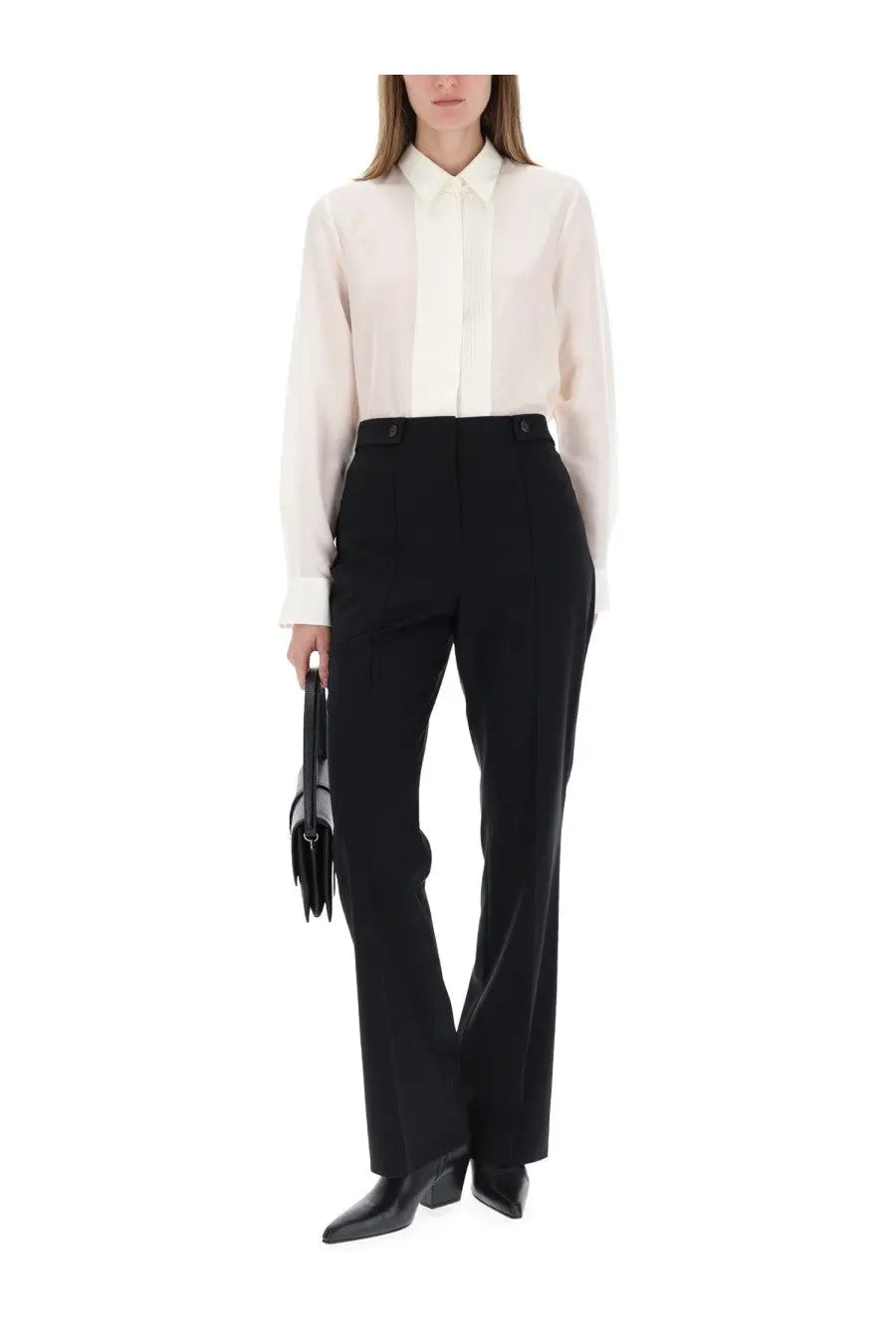 A sleek black leather handbag with structured design and tassel detailing featured with BOSS women’s white shirt