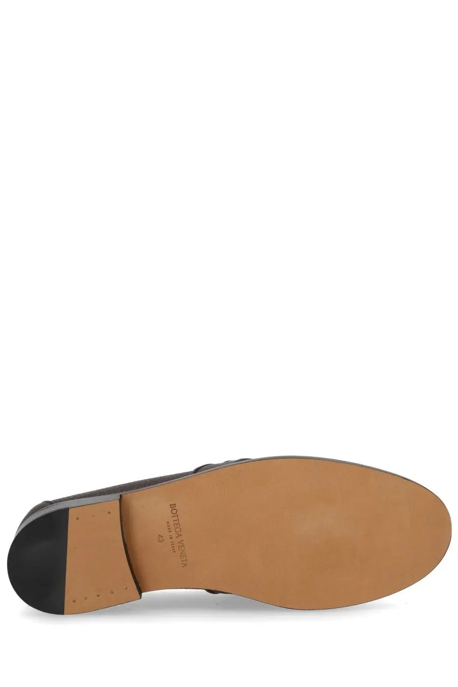 Back view of bottega veneta men’s astaire loafer in black leather with tan rubber sole and stitched heel branding
