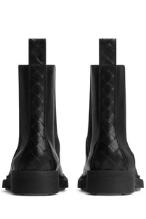 Black bottega veneta men’s chelsea boot ben with woven leather intrecciato pattern and chunky rubber soles