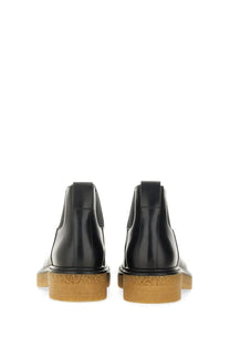 Bottega Veneta men’s Chelsea boot Haddock black with black leather upper and chunky tan rubber sole