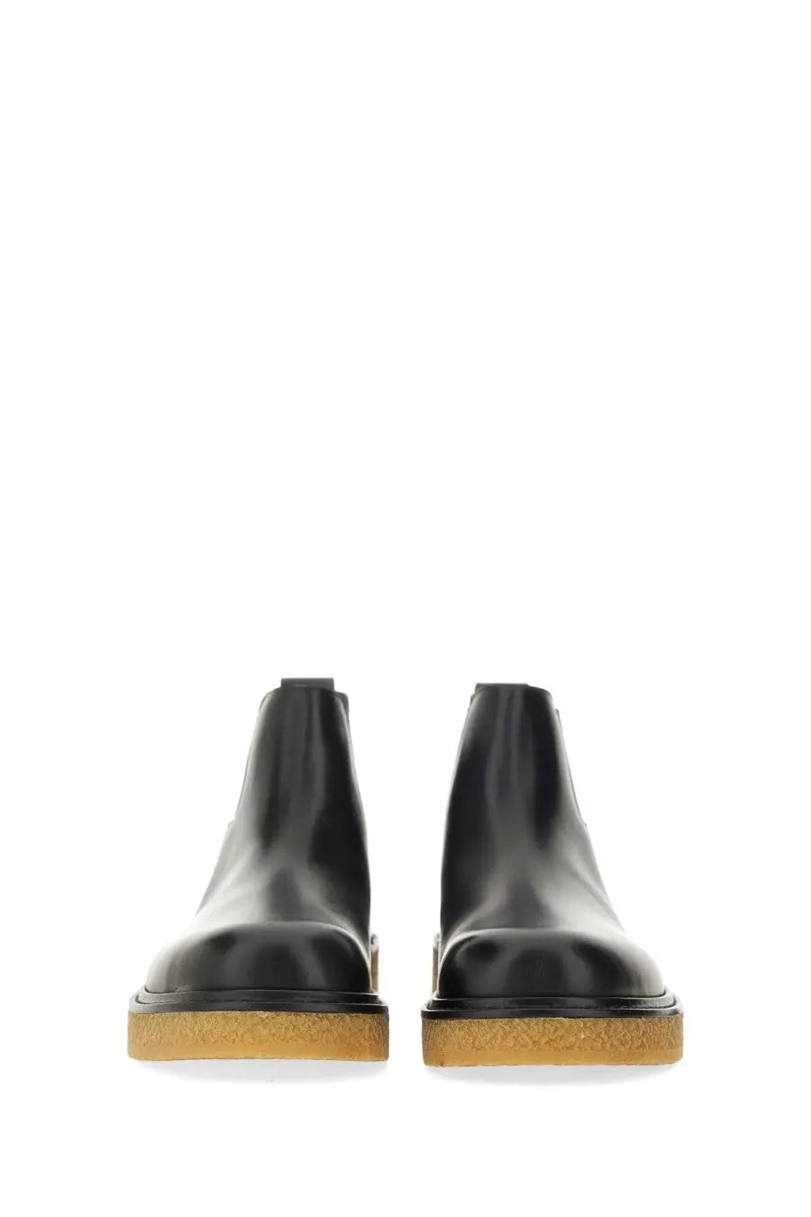 Bottega Veneta men’s chelsea boot haddock black in black leather with textured tan rubber sole