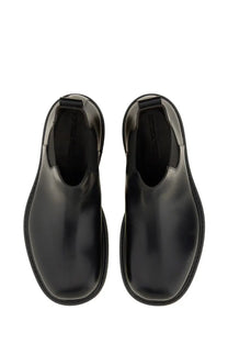 Bottega Veneta men’s chelsea boot haddock black with black patent leather chunky sole and elastic side gussets visible