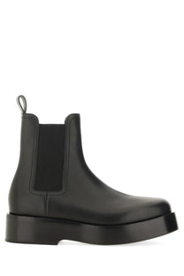 Bottega Veneta men’s black leather Chelsea boot with chunky platform sole and elastic side panels