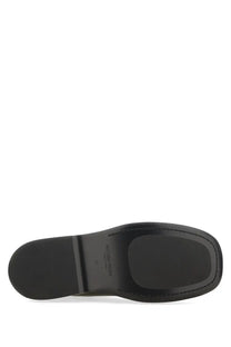 Black leather sole with matte finish and embossed branding on bottega veneta men’s chelsea boot torino black