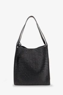 Black woven leather tote bag with structured interlaced pattern and slender shoulder straps by Bottega Veneta