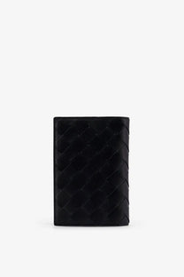 Black leather wallet with distinctive woven pattern by bottega veneta for men passport holder in black leather