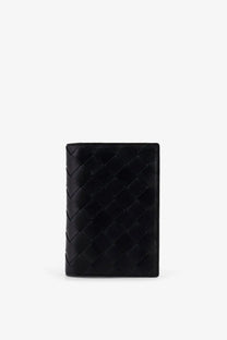 Bottega Veneta men’s black leather passport holder with distinctive woven pattern and sleek design