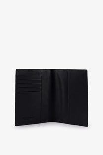 Bottega Veneta men’s black leather passport holder with multiple card slots and minimalist design