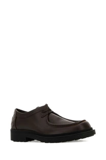 Dark brown leather lace-up shoe with textured heel and chunky black rubber sole shown from the back side by bottega veneta