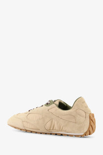 Bottega Veneta men’s orbit flash beige suede sneaker with olive green accents and textured rubber sole