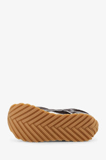 Bottega Veneta men’s orbit mesh sneaker in black and white with tan rubber sole and herringbone tread pattern