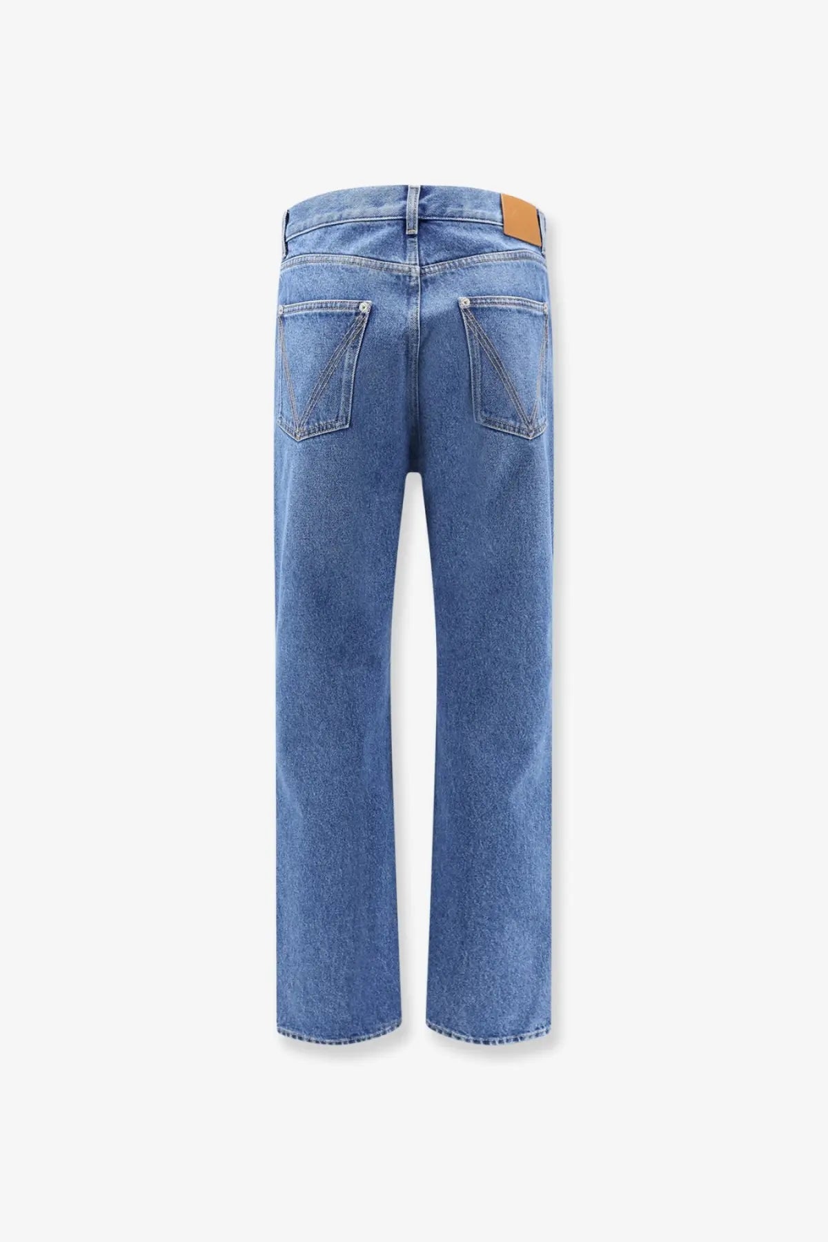 Bottega Veneta men’s blue straight-leg cotton jeans with a tan leather brand patch at the waistband back view