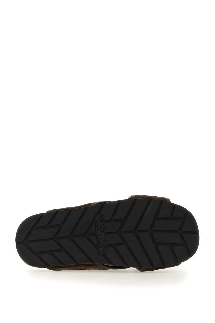 Black rubber sole with geometric tread pattern and bottega veneta embossed on men’s sandal tarik brown