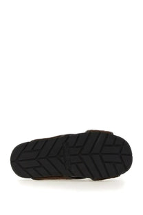 Black rubber sole with geometric tread pattern and bottega veneta embossed on men’s sandal tarik brown