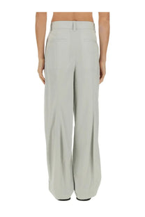 Light gray wide-leg bottega veneta men’s silk and cotton pants with tailored fit and subtle back pleats shown from the back