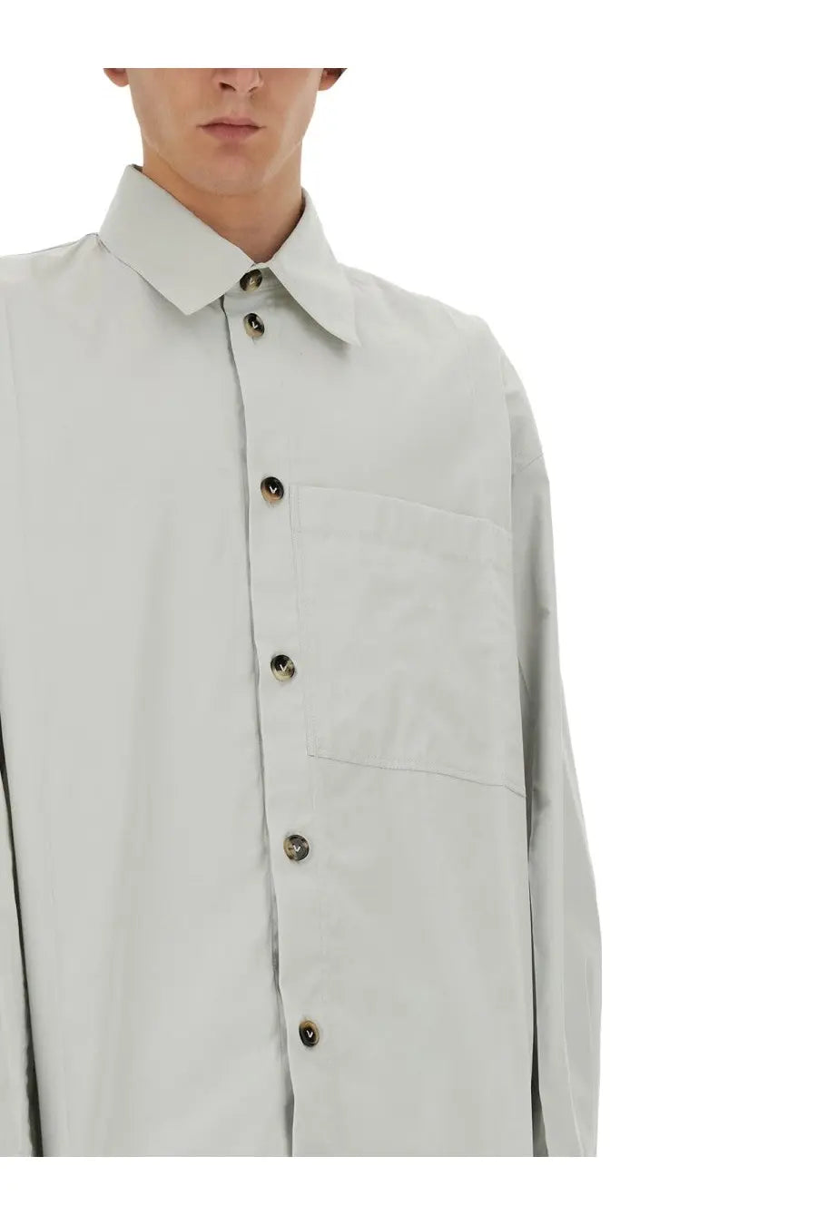 A light gray long-sleeved button-up silk shirt with classic collar and chest pocket by Bottega Veneta men’s beige collection