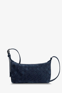 Dark blue woven leather crossbody bag with sleek structured design and adjustable strap from Bottega Veneta Men’s Traveler collection