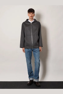 Dark gray zip-up hoodie with subtle texture and contrasting silver zipper paired with bottega veneta men’s wide leg jeans blue
