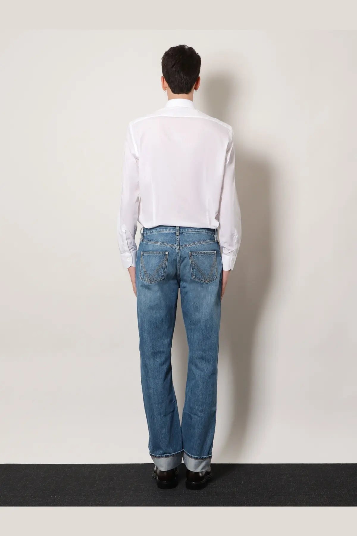 Bottega Veneta men’s wide leg blue denim jeans with classic five-pocket design and rolled cuffs