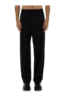 Black tailored wool trousers with relaxed fit and subtle pleats at waistband from bottega veneta mens blue pants