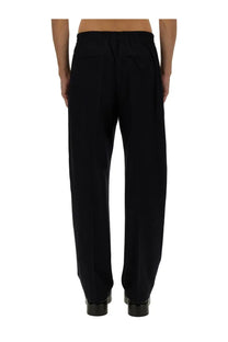 Black wide-leg wool trousers with relaxed fit and elastic waistband by bottega veneta mens blue pants