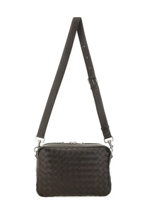 Bottega Veneta unisex black woven leather crossbody bag with silver toned hardware in intracciated design