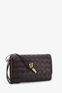Black woven leather clutch with gold-tone key-shaped clasp by bottega veneta women’s andiamo crossbody bag brown